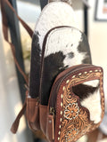 Cowhide and White Floral Tooled Sling Backpack