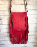 Turquoise Splatter Hide with Red Leather Fringe