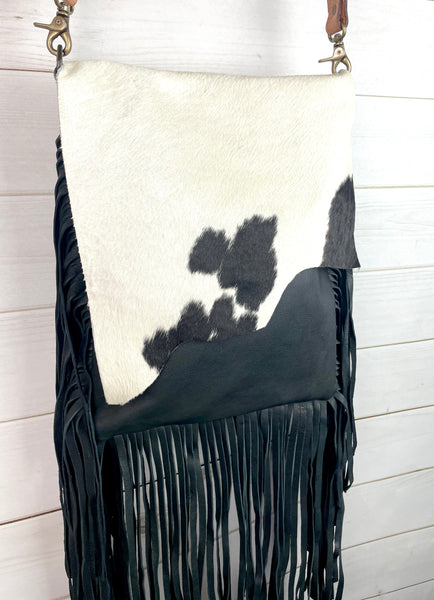 Black and White Raw Hide Flap on Black Leather with Fringe Crossbody Bag